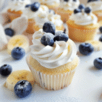 Angel Food Cake Shortcake 13 Angel food shortcakes topped with whipped cream, surrounded by banana slices and blueberries
