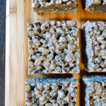 Black Sesame Rice Krispies 11 Neatly sliced Black Sesame Rice Krispies treats on a wooden surface