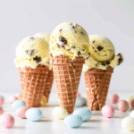 Creamy Cadbury Mini Egg Ice Cream You’ll Love 11 Cadbury Mini Egg Ice Cream scoop in pastel cone with crushed mini eggs