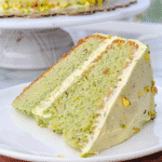 Flourless Pistachio Cake – Insanely Good, Jaw-Dropping Flavor Combo 9 Flourless pistachio cake with frosting and crushed nuts