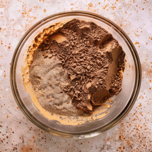 Cocoa powder and flour on top of cookie dough base