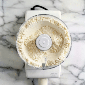 Pie dough for Bourbon Pecan Pie Chocolate mixing in a food processor