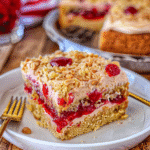 How to Make Peanut Butter Jelly Poke Cake 13 Slice of peanut butter jelly poke cake on a white plate with cake in background